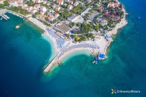 an aerial view of an island in the ocean at Apartments Cindrić in Selce