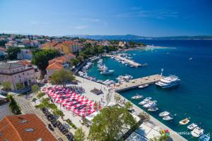 an aerial view of a harbor with boats in the water at Apartments Cindrić in Selce