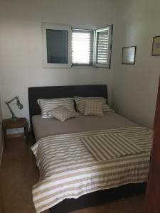 Postel nebo postele na pokoji v ubytování Apartments Lilly