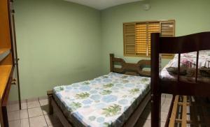 A bed or beds in a room at Chácara Nativa