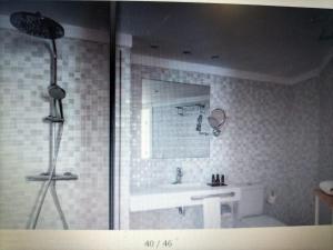 Een badkamer bij HOTEL FLAMINGO CLUB