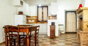 Kuchyň nebo kuchyňský kout v ubytování Alloggio Turistico Caria Mariano
