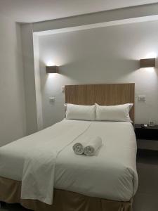 Ένα ή περισσότερα κρεβάτια σε δωμάτιο στο Hotel HSR