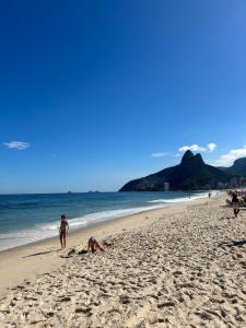 a group of people playing on the beach at Apartment in IPANEMA in Rio de Janeiro