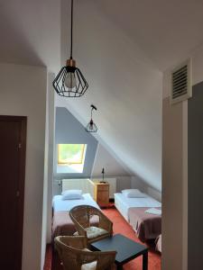 Posteľ alebo postele v izbe v ubytovaní Apartamenty Amadeus