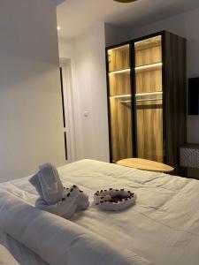 a bedroom with two wedding shoes on a bed at Elite Pyramids Boutique Hotel in Cairo