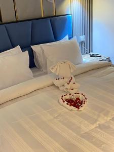 a stuffed animal sitting on top of a bed at Elite Pyramids Boutique Hotel in Cairo