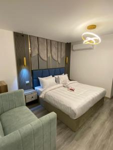 Tempat tidur dalam kamar di Elite Pyramids Boutique Hotel