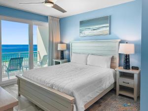 a bedroom with a bed with a view of the ocean at blu #606 Luxury 2 Bd Beachfront Condo in Fort Walton Beach