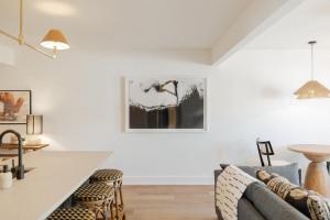 a living room with a couch and a table at The Lumina at The Tarrymore in Wrightsville Beach