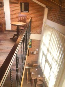 a stairway with a table and a table and a tableearcher at Hermoso LOFT rustico in Tenancingo de Degollado