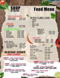 a menu for a food menu on a wall at Ocean Blue Villa in Lucea in Point