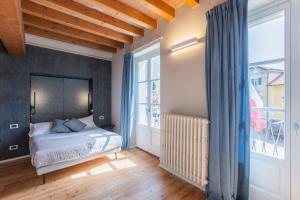 Кровать или кровати в номере Albergo Del Sole