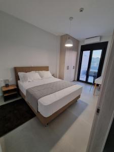Postelja oz. postelje v sobi nastanitve 10 Apartments & Suites Athens