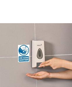 a hand reaching for a toilet next to a sign at Luxurious En-suite Soft Water Air Conditioning TV RIPPLE in London