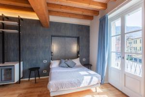 Кровать или кровати в номере Albergo Del Sole