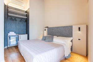 Кровать или кровати в номере Albergo Del Sole