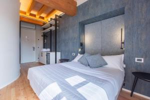 Кровать или кровати в номере Albergo Del Sole