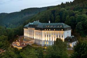 a large building in the middle of a forest at New flat, Jachymov (Klinovec resort) in Karlovy Vary