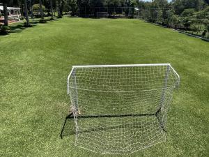 a soccer goal in the middle of a field at Cozy & Relaxing Resort Oasis ~ Sports Field ~ Pool in Luque
