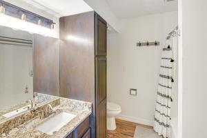 a bathroom with a sink and a toilet at Cozy Mtn Condo with Grill, 28 Mi to Wolf Creek! in Pagosa Springs