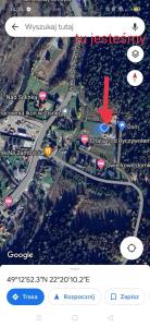 a screenshot of a google map with a red arrow at W Cisnej pod 1. in Cisna