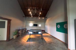a large room with a ping pong table in it at Edenia Hotel & Nature in El Calafate