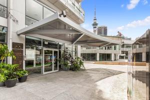 an office building with an awning over a courtyard at Urban Escape: Prime Location in Auckland