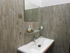 a bathroom with a sink and a mirror at The Green Edge in Dambulla