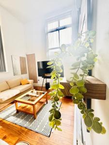 A seating area at Double height ceiling spacious city apartment