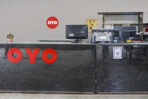 a xo sign on a counter in an office at OYO Hotel Triveni. in Patna