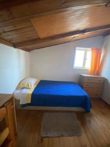 Postel nebo postele na pokoji v ubytování HOSTAL VALDIVIA