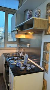 a kitchen with a stove and a counter top at Lilli's House in Gallipoli
