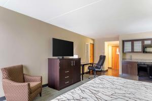 a hotel room with a bed and a flat screen tv at Best Western Plus Knoxville Cedar Bluff in Knoxville