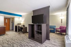 a hotel room with a flat screen tv in a room at Best Western Plus Knoxville Cedar Bluff in Knoxville
