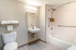 a bathroom with a toilet and a sink and a tub at Best Western Plus Knoxville Cedar Bluff in Knoxville