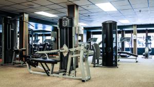 a gym with lots of treadmills and machines at King Size bed Room with Hot tub in Gatlinburg