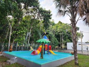 a childrens play area with a playground at Encanto Llanero XKPDestinations. in Villavicencio