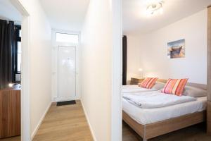 Ein Bett oder Betten in einem Zimmer der Unterkunft Berliner Hof - HOF/210