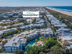 an aerial view of the holiday management sign at the beach at Drift North Beachfront Apartments - Private Apartments in Kingscliff