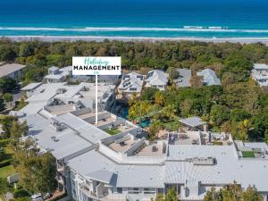 an aerial view of a house with a sign that reads halfway management at Drift North Beachfront Apartments - Private Apartments in Kingscliff
