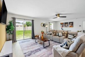 a living room with a couch and a table at spacious 4-bedroom WITH KING BED in Palm Coast