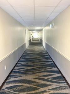 an empty hallway with a carpet in an office building at Kiteville Phoenixville in Phoenixville