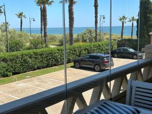 a car parked in a parking lot on a balcony at Primera Linea de Playa con Vistas al Mar in Isla Canela