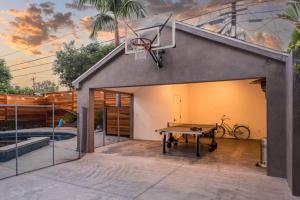 a basketball hoop on the roof of a house at Prestigious 5BR Mansion w/ Pool, Theatre & Jacuzzi in Los Angeles