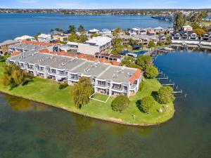 an aerial view of a house on an island in the water at Yarrawonga Lakeside Apartment 25 in Mulwala