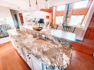 a kitchen with a marble counter top in a room at Pet Friendly Mtn Cabin on 40 Acres 2 King Beds in Leadville