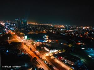 a city lit up at night with traffic at Dreamstay36 3R2B 8pax Meritus perai in Perai