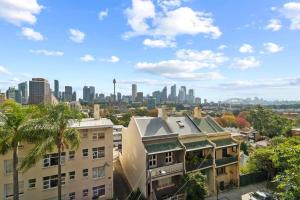 a view of a city skyline with buildings at Modern Potts Point Studio in Sydney