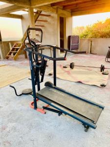 a exercise cart sitting on the floor in a garage at Casa Real Quetzalcóatl in Puerto Escondido